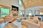 Spacious Open Concept Living Area with 70-inch Smart TV